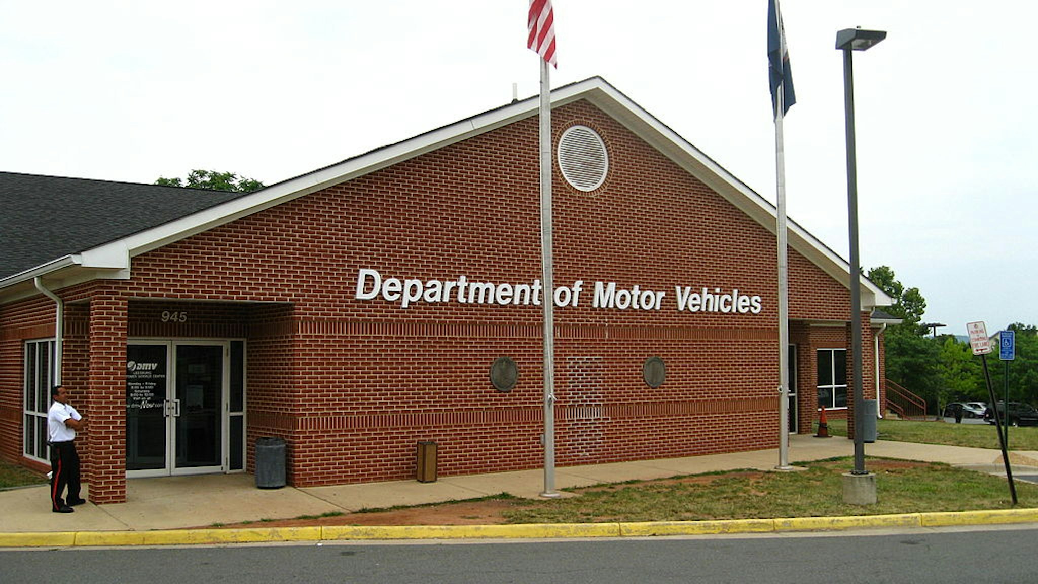 An Ashburn woman ran her silver Honda Civic into the left side of the Virginia Department of Motor Vehicles customer service center in Leesburg today. The car crashed into a stalk room. No one was injured. (Kafia Hosh/The Washington Post via Getty Images)