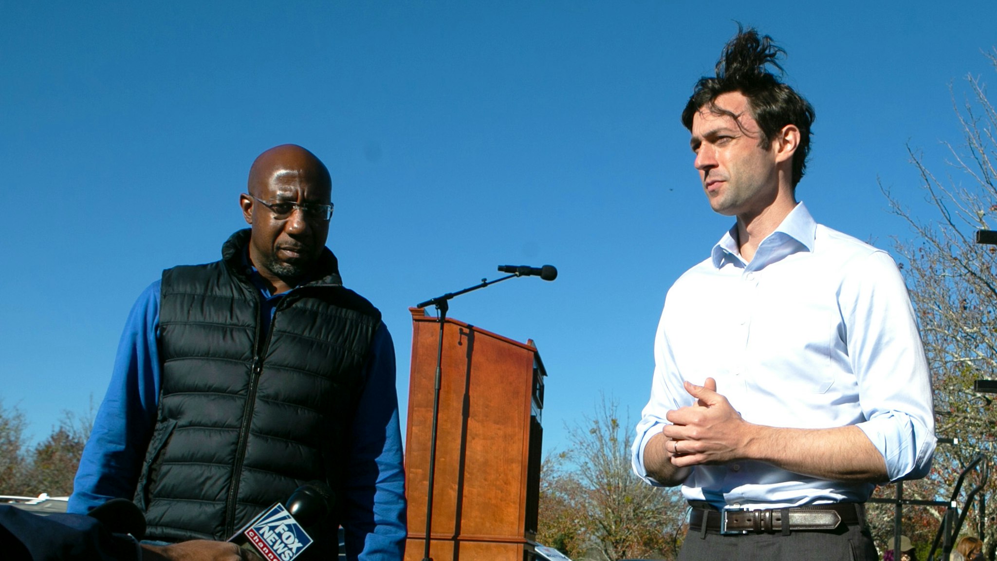 CONYERS, GA - DECEMBER 05: Democratic U.S. Senate candidates Raphael Warnock (L) and Jon Ossoff take questions from the press during an outdoor drive-in rally on December 5, 2020 in Conyers, Georgia. Ossoff and Warnock face Republican candidates Sen. David Purdue (R-GA) and Sen. Kelly Loeffler in a runoff election that will take place January 5th.