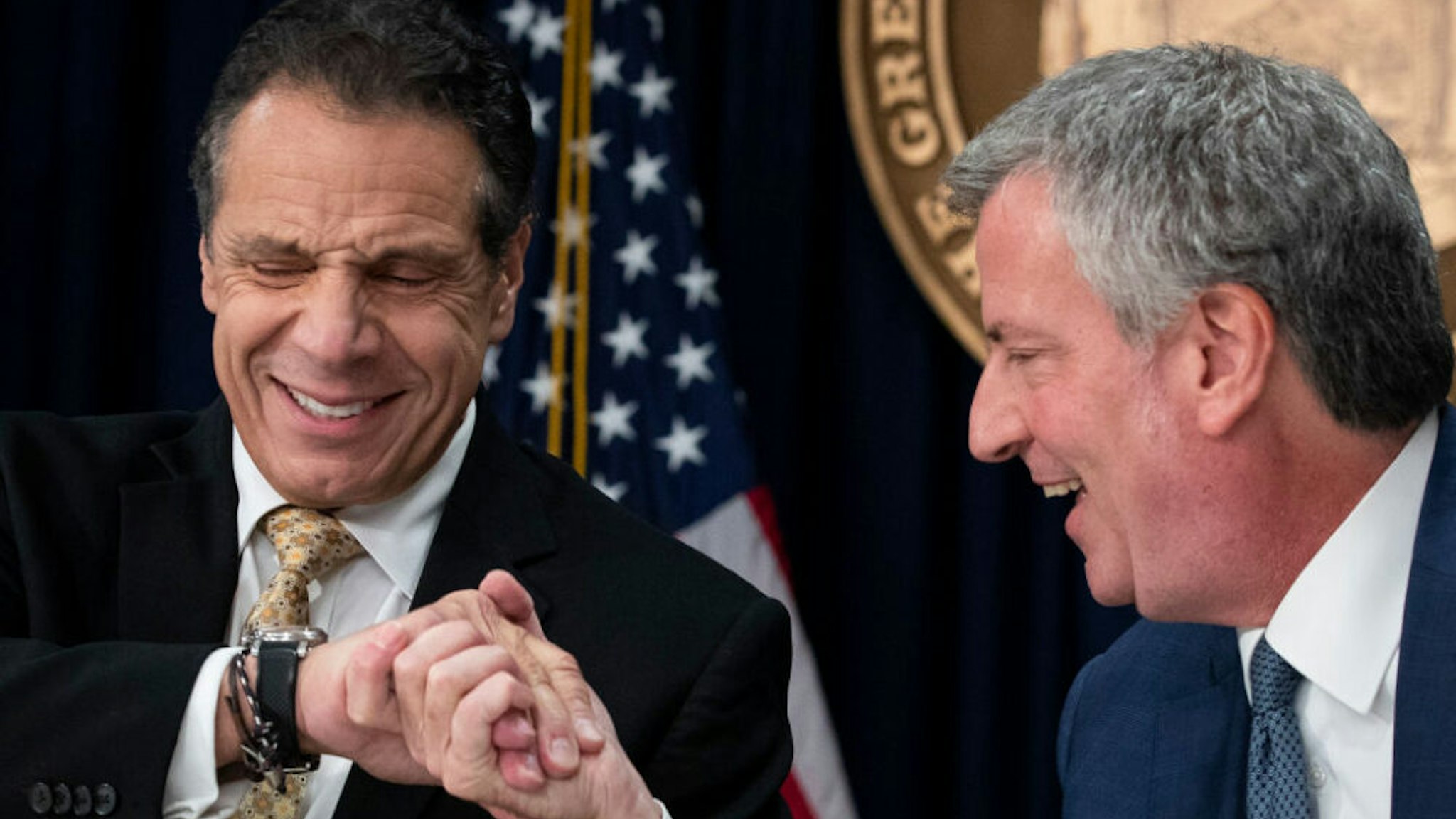 NEW YORK, NY - NOVEMBER 13: (L-R) New York Governor Andrew Cuomo and New York City Mayor Bill de Blasio shake hands during a press conference to discuss Amazon's decision to bring a new corporate location to New York City, November 13, 2018 in New York City. Amazon announced earlier in the day that it has chosen Arlington, Virginia and Long Island City in Queens as the two locations, which will both serve as additional headquarters for the company. Amazon says each location will create 25,000 jobs.