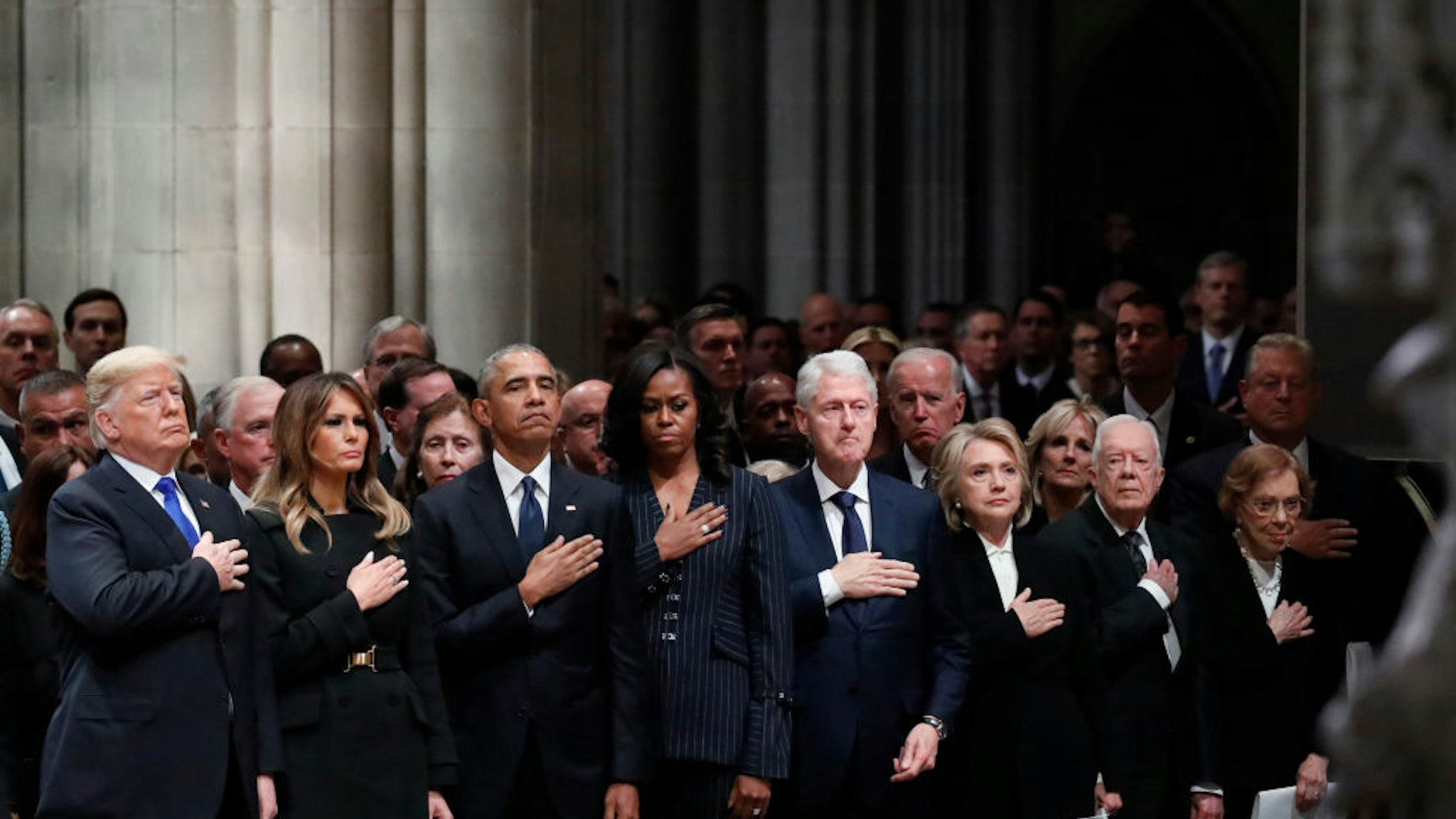 WASHINGTON, DC - DECEMBER 05: (AFP OUT) From left, President Donald Trump, first lady Melania Trump, former President Barack Obama, former first lady Michelle Obama, former President Bill Clinton, former Secretary of State Hillary Clinton, and former President Jimmy Carter and former first lady Rosalynn Carter attend the state funeral of former U.S. President George H. W. Bush at the Washington National Cathedral on December 5, 2018 in Washington, DC. President Bush will be buried at his final resting place at the George H.W. Bush Presidential Library at Texas A&amp;M University in College Station, Texas. A WWII combat veteran, Bush served as a member of Congress from Texas, ambassador to the United Nations, director of the CIA, vice president and 41st president of the United States. (Photo by Alex Brandon - Pool/Getty Images)