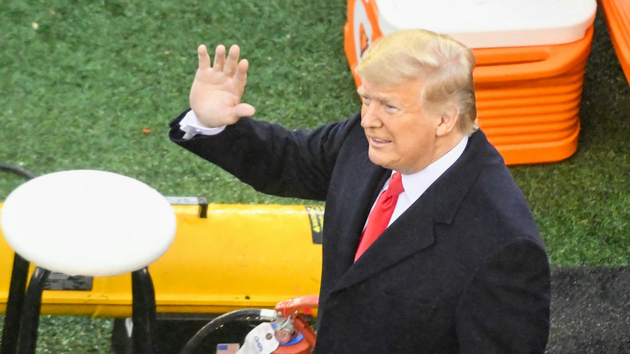 President Donald Trump waves during the Army-Navy game on December 14, 2019 at Lincoln Financial Field in Philadelphia PA.