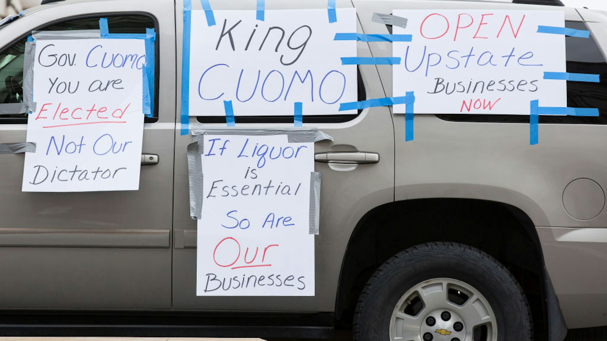 ALBANY, NY - APRIL 22: A vehicle is covered in signs criticizing New York State Governor Andrew Cuomo during an Operation Gridlock protest outside of the New York State Capitol Building on April 22, 2020 in Albany, New York. Protestors are calling on Cuomo to reopen New York State amidst a shutdown of all non-essential businesses due to the Coronavirus pandemic. (Photo by Stefani Reynolds/Getty Images)