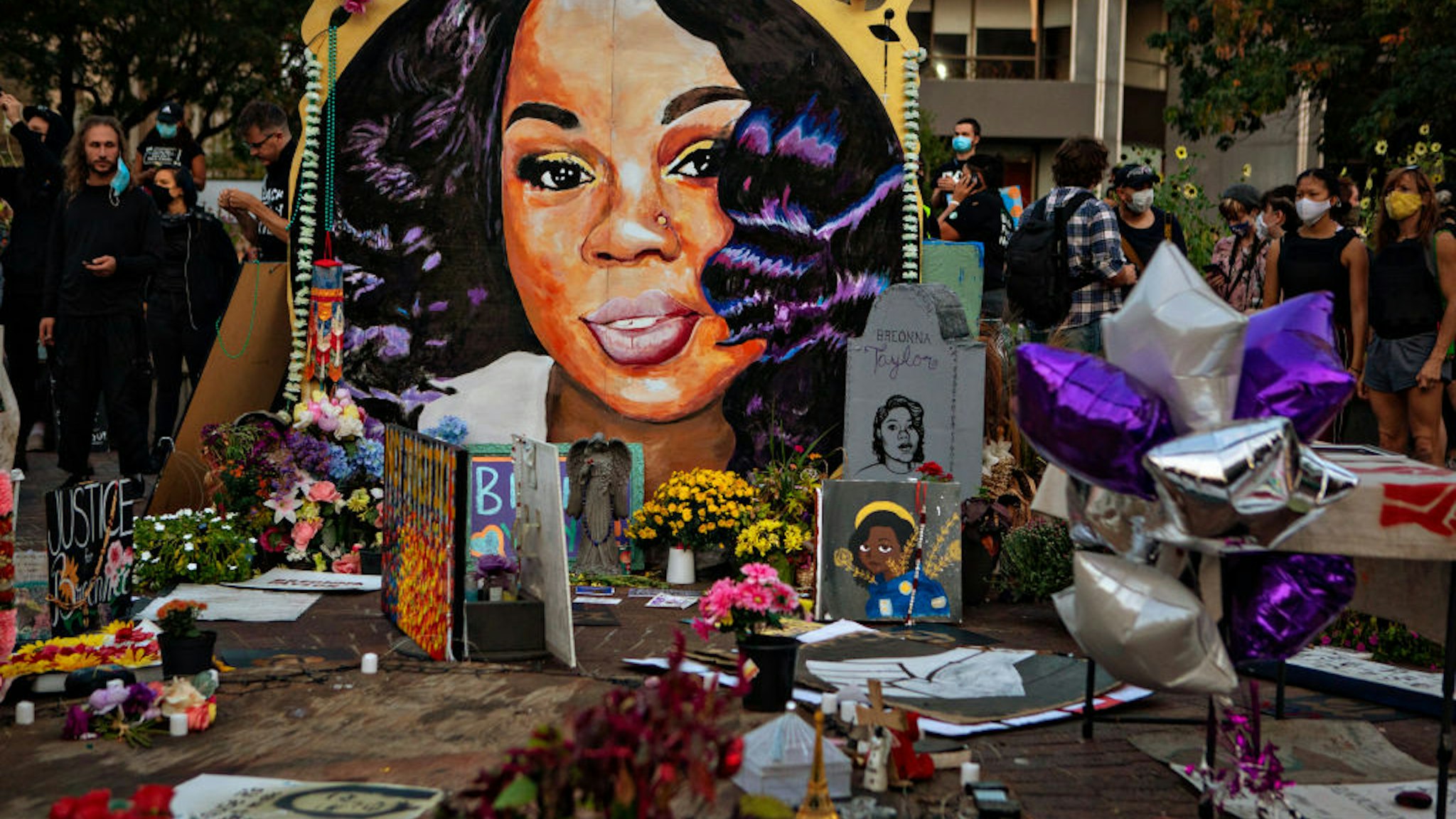 People gather at Breonna Taylors make shift memorial in Injustice Square Park in downtown Louisville on Saturday, Sept. 26, 2020 in Louisville, KY.