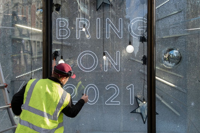After a bleak year of Coronavirus pandemic misery, a contractor applies stars to window glass in Harvey Nichols's Christmas-themed window which urges Londoners to be optimistic for the coming year, on 13th November 2020, in London, England. (Photo by Richard Baker / In Pictures via Getty Images)