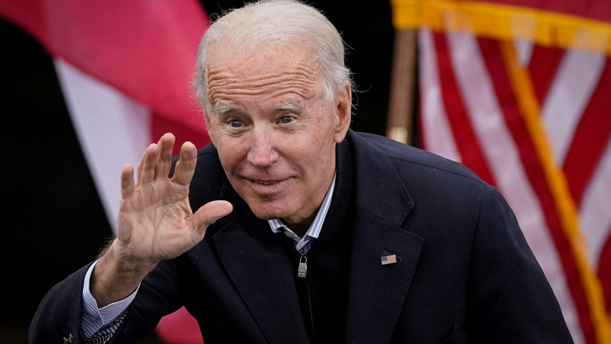 U.S. President-elect Joe Biden gestures to the crowd as he delivers remarks during a drive-in rally for U.S. Senate candidates Jon Ossoff and Rev. Raphael Warnock at Pullman Yard on December 15, 2020 in Atlanta, Georgia.