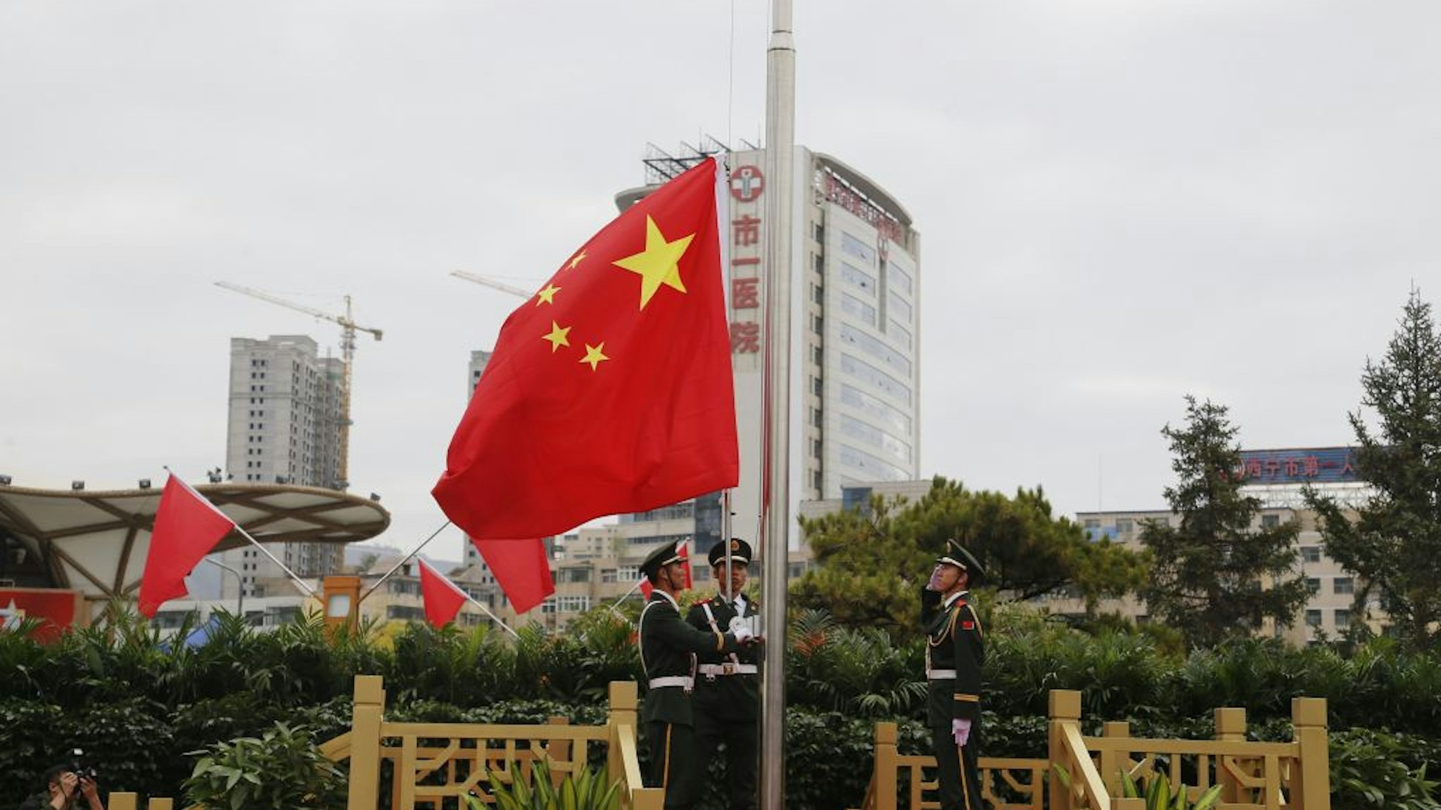 Soldiers of the People's Liberation Army (PLA) honor guard perform the flag-raising ceremony at a square to mark the 71st Anniversary of the Founding of the People's Republic of China on October 1, 2020 in Xining, Qinghai Province of China.