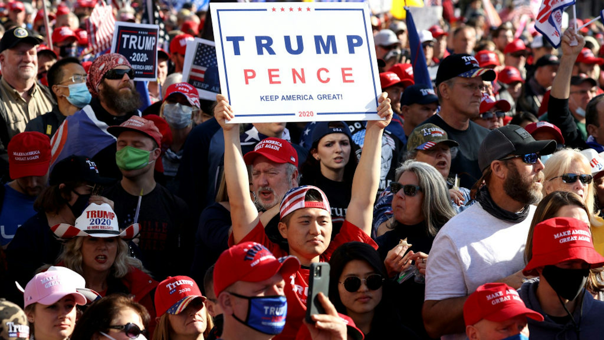 People participate in the “Million MAGA March” from Freedom Plaza to the Supreme Court, on November 14, 2020 in Washington, DC.