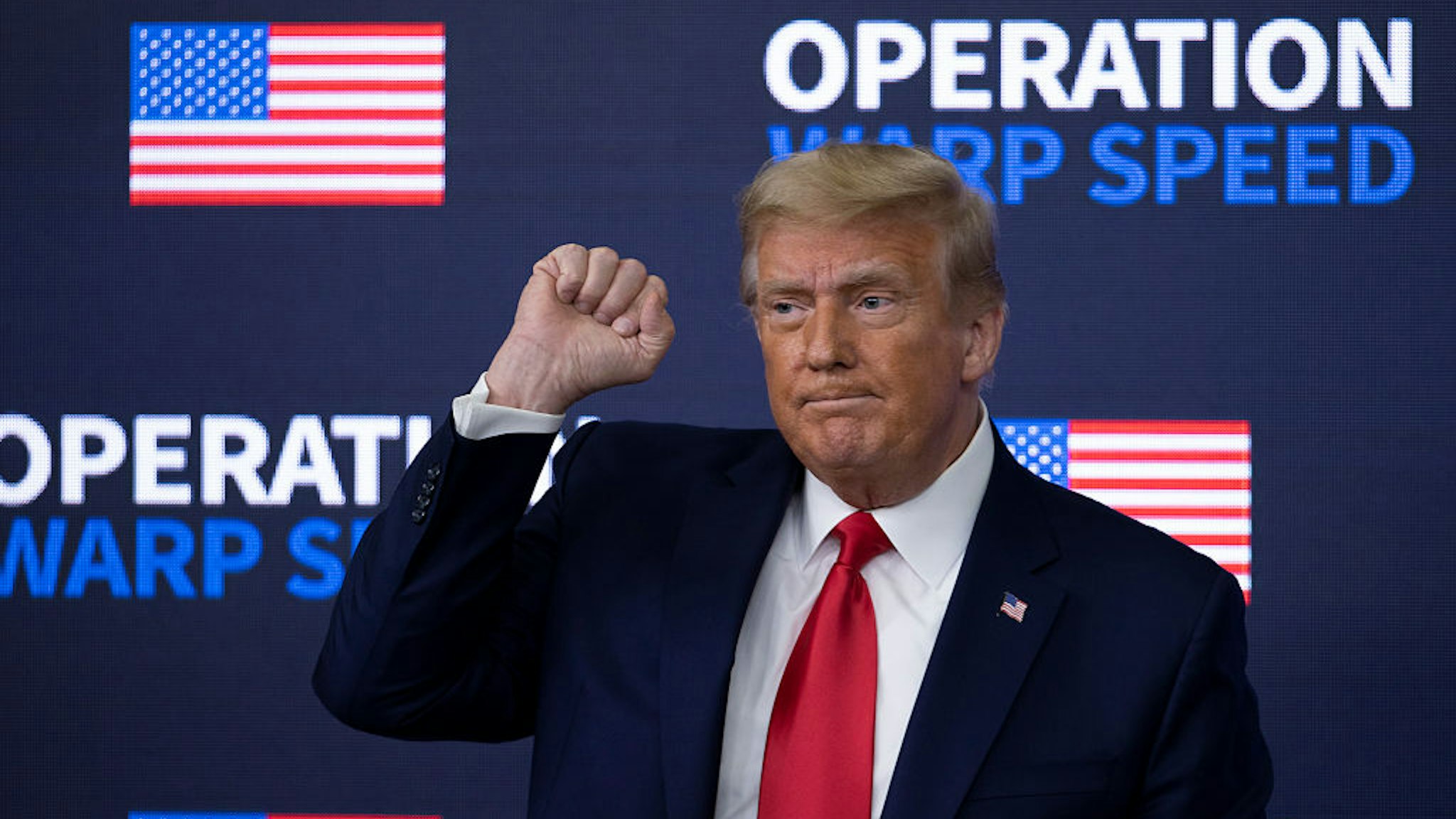 US President Donald Trump greets the crowd before he leaves at the Operation Warp Speed Vaccine Summit on December 08, 2020 in Washington, DC.