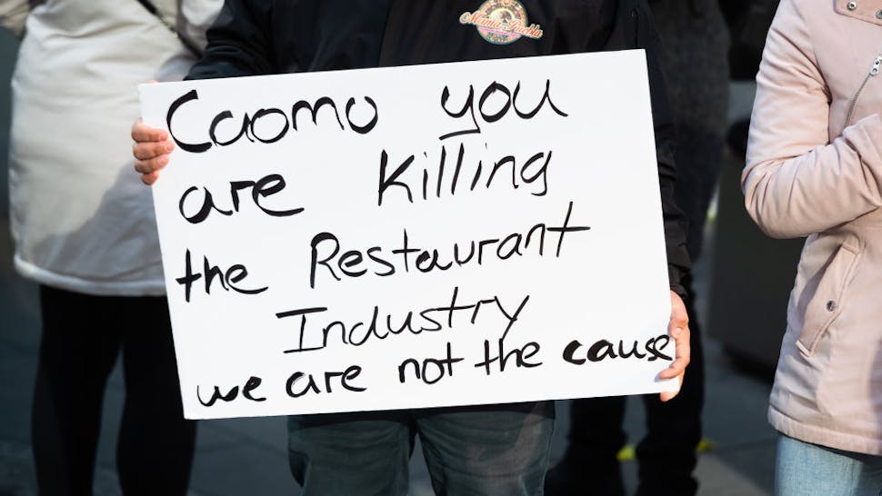 NYC protest Restaurant owners and workers protest in Times Square against new regulations that ended indoor dining on December 15, 2020 in New York City.