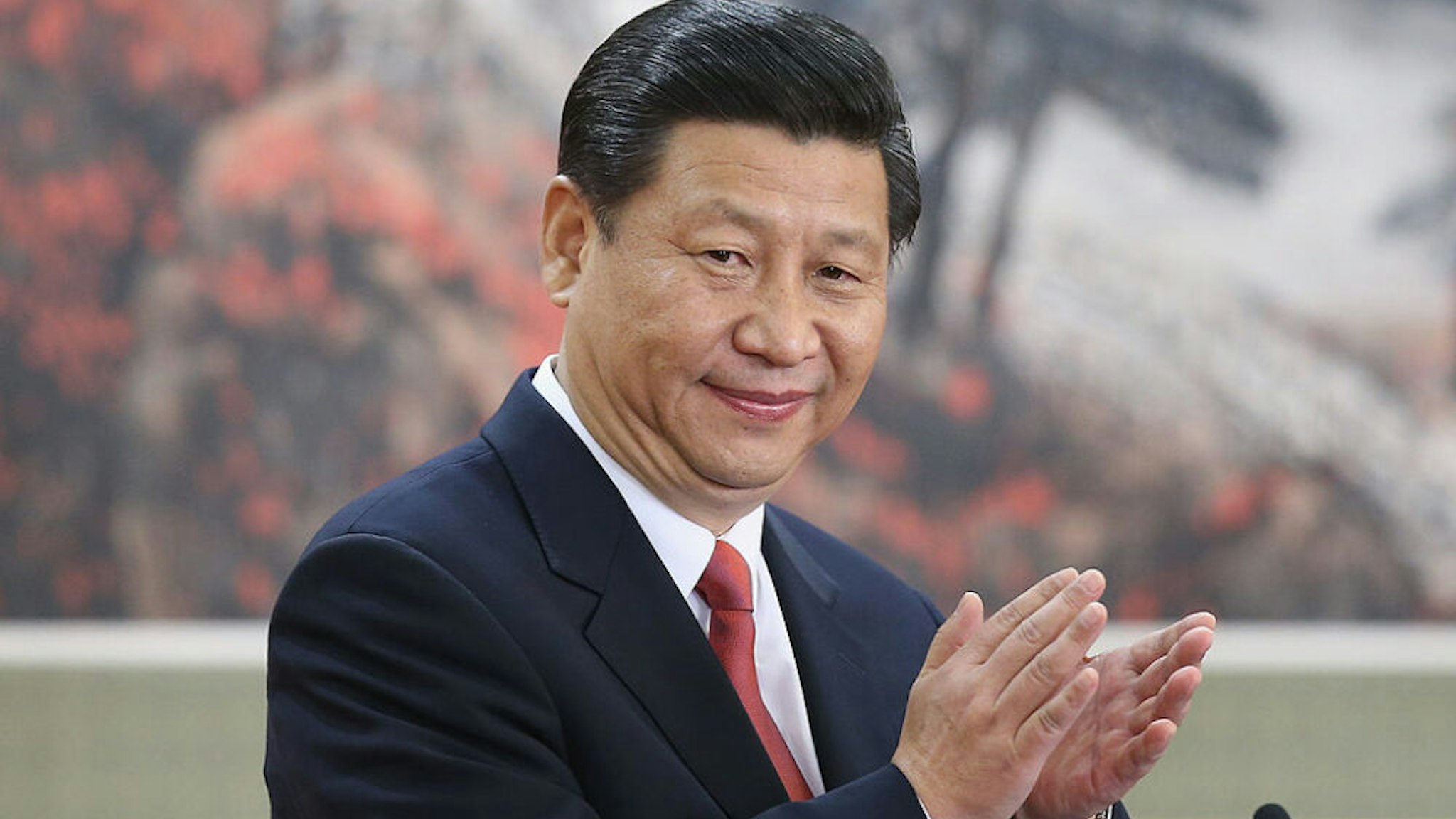 BEIJING, CHINA - NOVEMBER 15: Chinese Vice President Xi Jinping, one of the members of new seven-seat Politburo Standing Committee, greets the media at the Great Hall of the People on November 15, 2012 in Beijing, China. China's ruling Communist Party today revealed the new Politburo Standing Committee after its 18th congress.