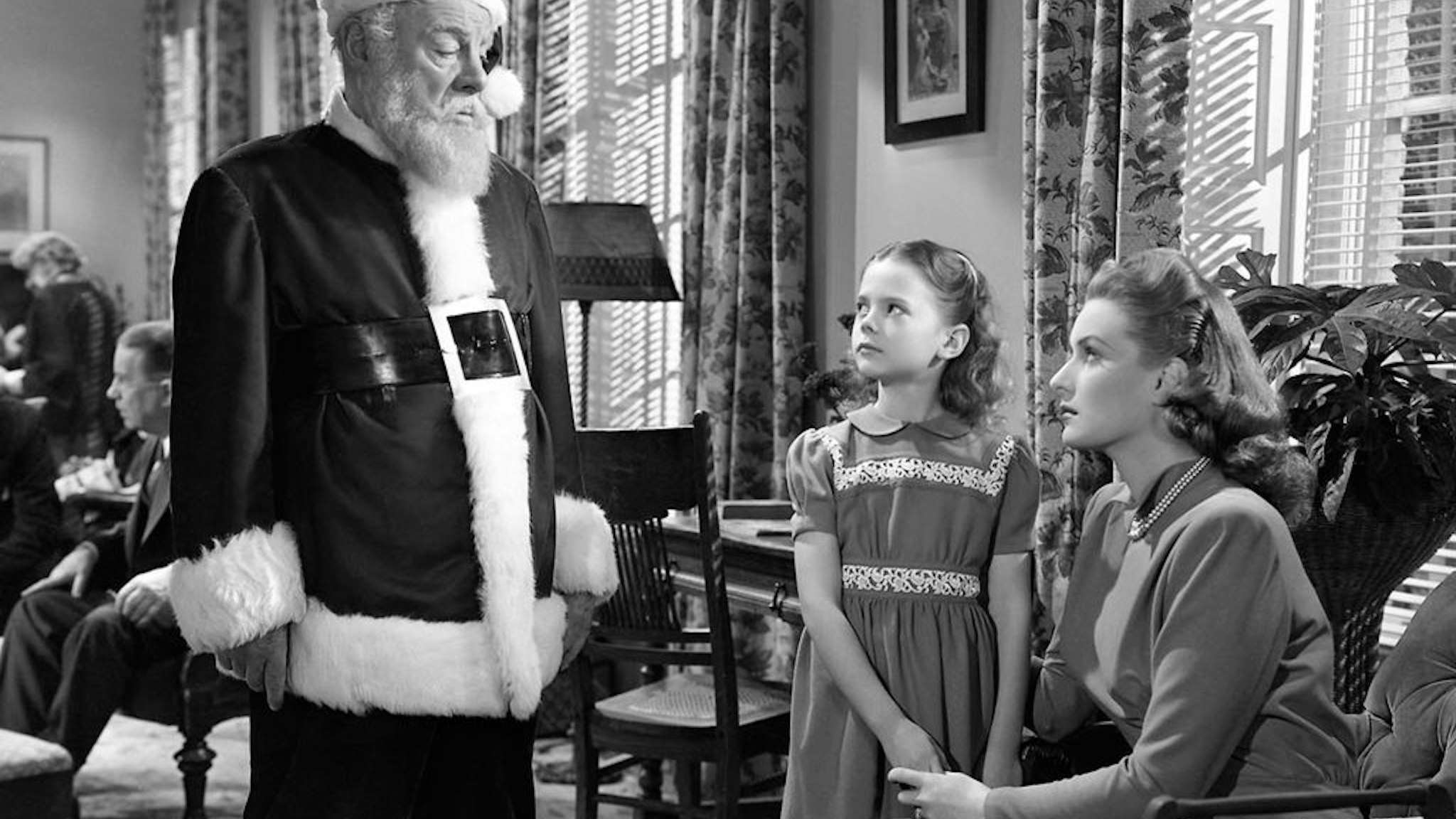 Left to right: Edmund Gwenn (1877 - 1959) as Kris Kringle, Natalie Wood (1938 - 1981) as Susan Walker and Maureen O'Hara as Doris Walker in 'Miracle On 34th Street', written and directed by George Seaton, 1947. (Photo by Silver Screen Collection/Getty Images)