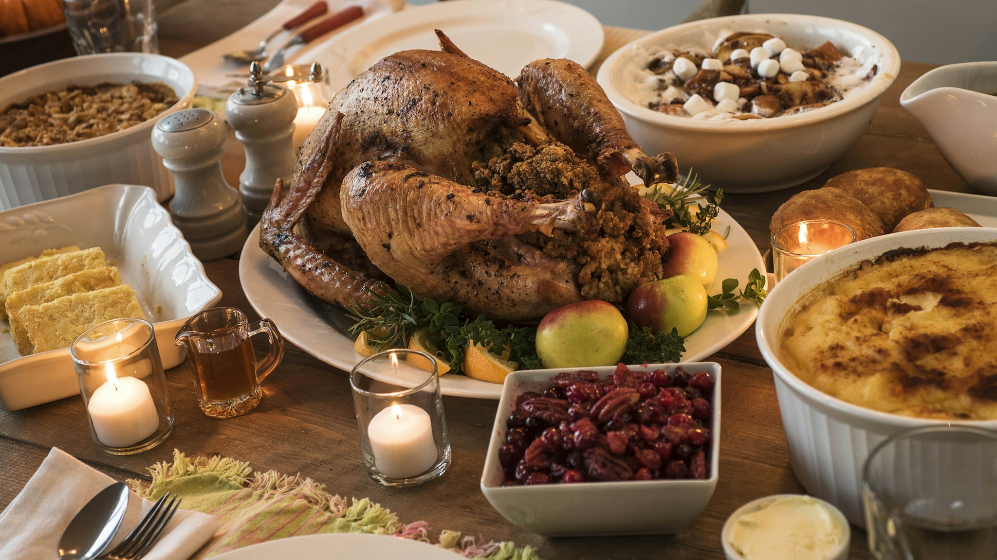 Dining table filled with thanksgiving food - stock photo