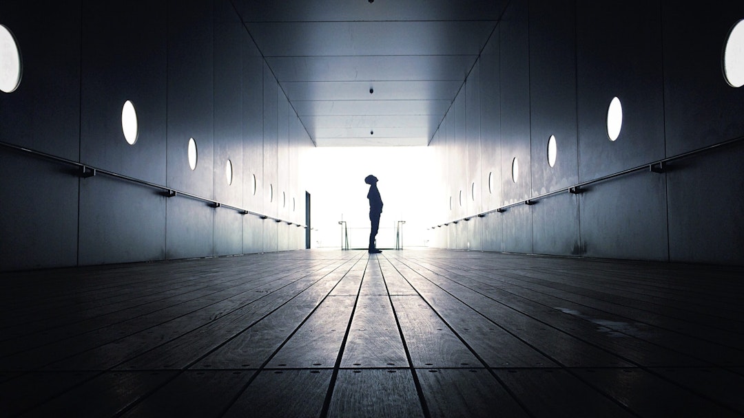 Full Length Of Silhouette Boy Standing In Corridor - stock photo