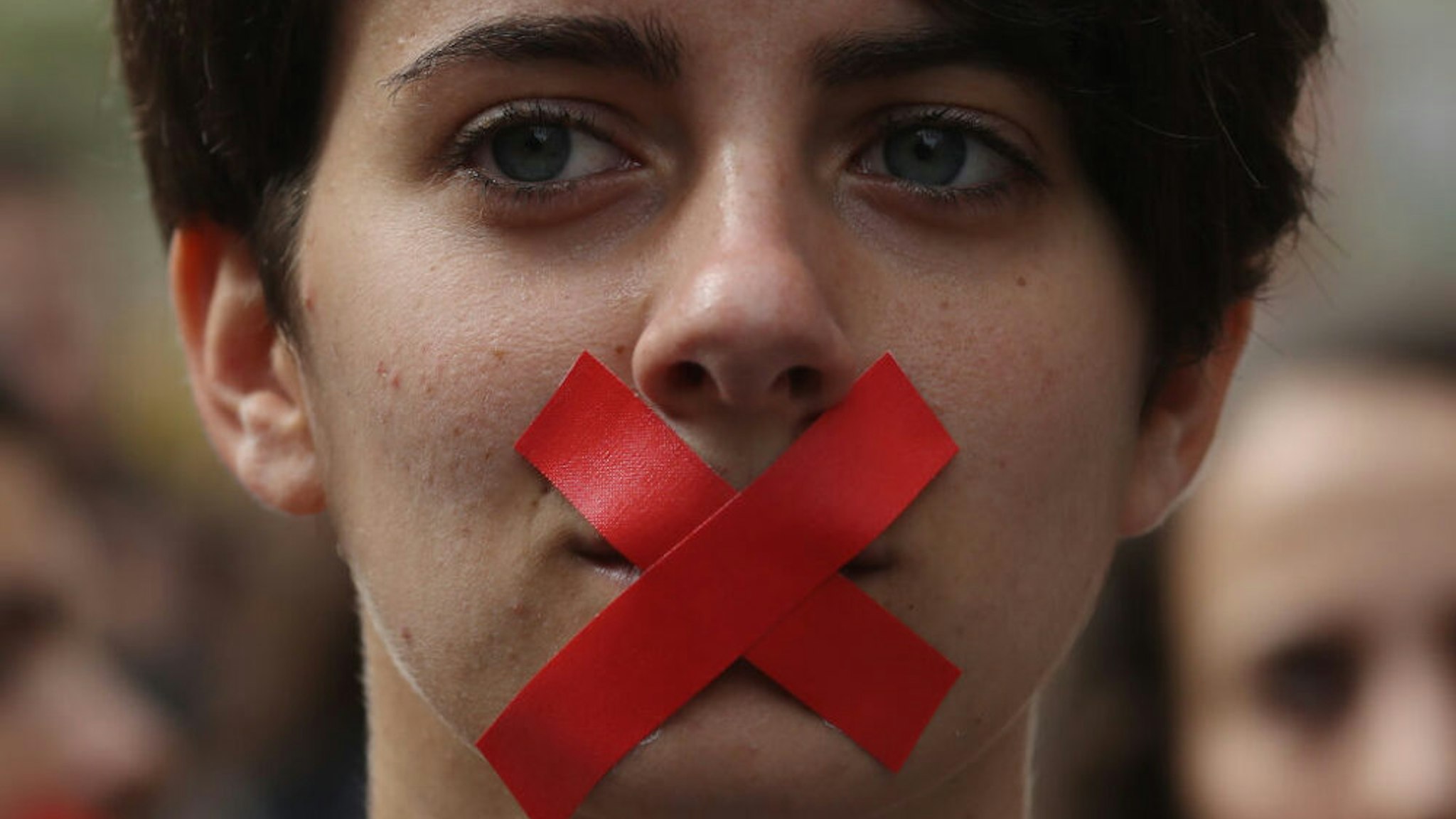 BARCELONA, SPAIN - OCTOBER 02: Students hold a silent protest against the violence that marred yesterday's referendum vote outside the University on October 2, 2017 in Barcelona, Spain. Catalonia's government met Monday to discuss plans to declare independence after the results of yesterday's disputed referendum.