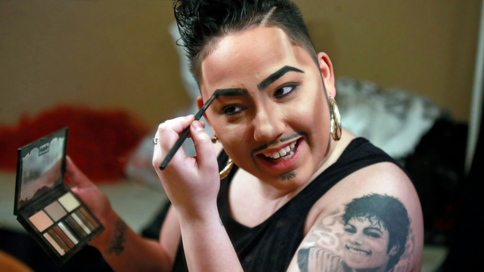 Janelle Felix finishes her make up before she performs as drag king Tenderoni on Saturday, March 24, 2018 at Berlin's "Drag Matinee." (Nuccio DiNuzzo/Chicago Tribune/Tribune News Service via Getty Images)