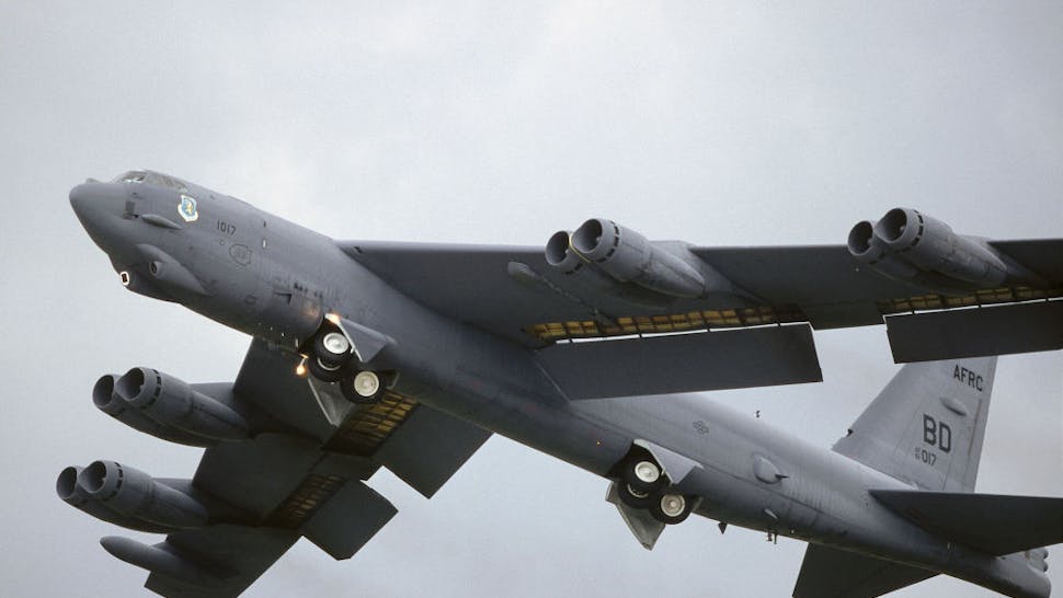 USAF Boeing B-52H Stratofortress taking-off with undercarriage retracting and trailing-edge wing flaps lowered at the 1998 Fairford Royal International Air Tattoo RIAT USAF Boeing B-52H Stratofortress taking-off with undercarriage retracting and trailing-edge wing flaps lowered at the 1998 Fairford Royal International Air Tattoo RIAT.
