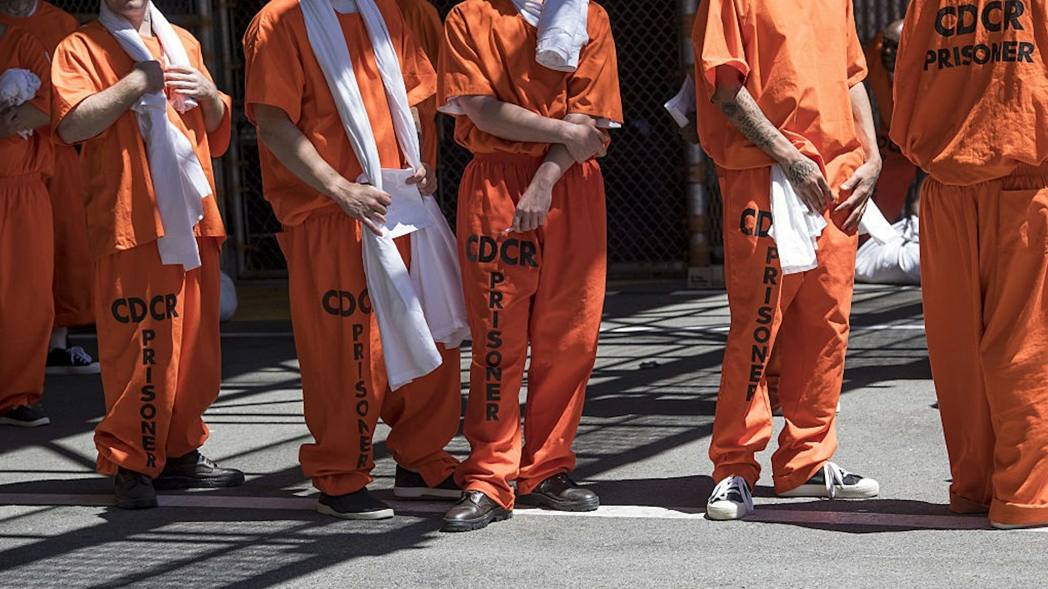 Inmates stand outside at San Quentin State Prison in San Quentin, California, U.S., on Tuesday, Aug. 16, 2016.