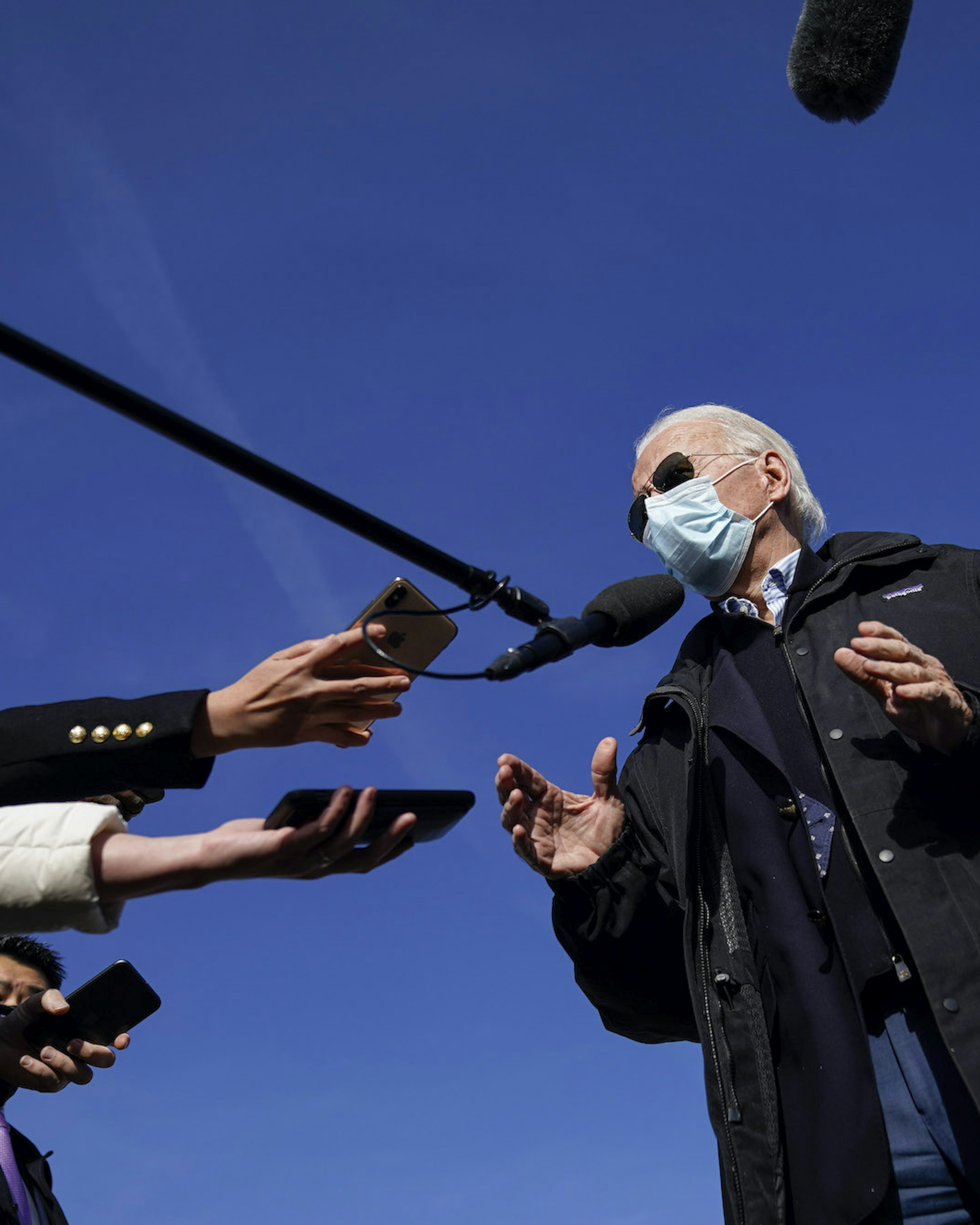 Joe Biden speaks to reporters before boarding his plane at New Castle Airport on December 15, 2020 in New Castle, Delaware. Biden is traveling to Georgia on Tuesday to campaign for Georgia Senate candidates Jon Ossoff and Raphael Warnock. (Photo by Drew Angerer/Getty Images)