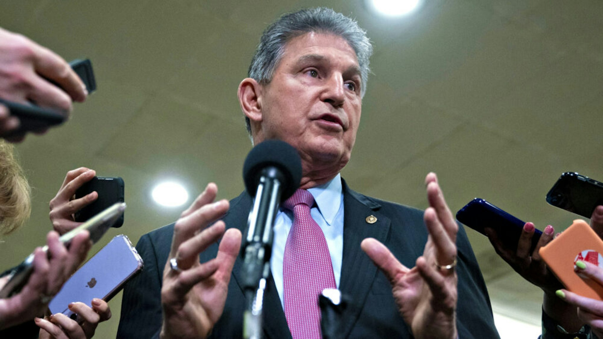 Senator Joe Manchin, a Democrat from West Virginia, speaks during a news conference in the Senate Subway of the U.S. Capitol in Washington, D.C., U.S., on Wednesday, Feb. 5, 2020. President Donald Trump's inevitable acquittal in the Senate's impeachment trial today has some House Democrats fretting that they should have delivered a more complete case to argue for his removal.
