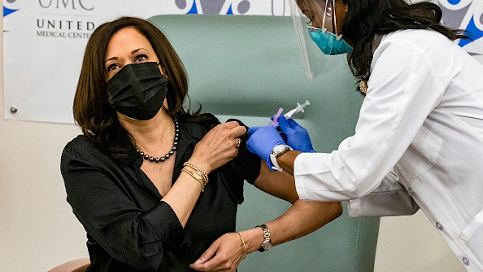 WASHINGTON, DC - DECEMBER 29: Registered Nurse Patricia Cummings administers the Moderna COVID-19 vaccine to Vice President-elect Kamala Harris at the United Medical Center on December 29, 2020 in Washington, DC. This is the Vice President-elect's first of two doses of the Moderna vaccine which was given emergency use authorization by the Food and Drug Administration less than two weeks ago. (