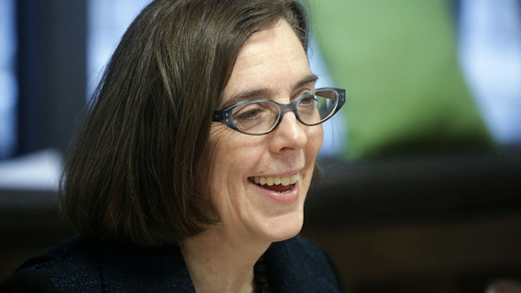 Kate Brown, governor of Oregon, smiles during an interview in Portland, Oregon, U.S. on Wednesday, Jan. 20, 2016. Brown, a Democrat, joined the state House of Representatives in 1991, was later elected to the Senate and served as secretary of state since 2009, before taking over as governor in February.