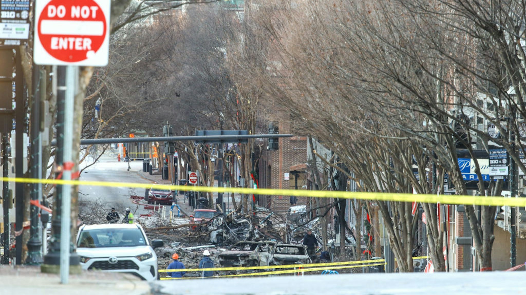 NASHVILLE, TENNESSEE - DECEMBER 25: Police close off an area damaged by an explosion on Christmas morning on December 25, 2020 in Nashville, Tennessee. A Hazardous Devices Unit was en route to check on a recreational vehicle which then exploded, extensively damaging some nearby buildings. According to reports, the police believe the explosion to be intentional, with at least 3 injured and human remains found in the vicinity of the explosion