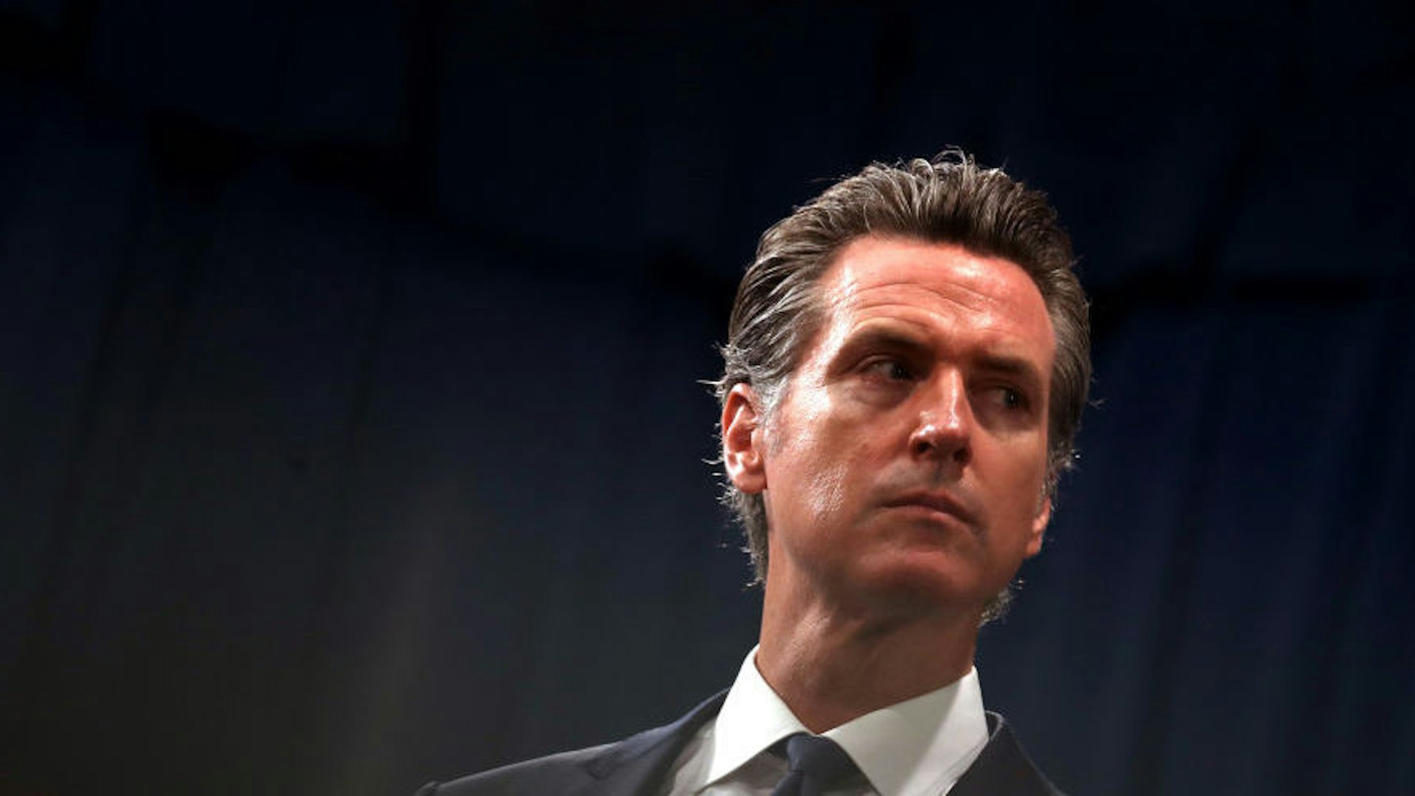 SACRAMENTO, CALIFORNIA - AUGUST 16: California Gov. Gavin Newsom looks on during a news conference with California attorney General Xavier Becerra at the California State Capitol on August 16, 2019 in Sacramento, California. California attorney genera Xavier Becerra and California Gov. Gavin Newsom announced that the State of California is suing the Trump administration challenging the legality of a new "public charge" rule that would make it difficult for immigrants to obtain green cards who receive public assistance like food stamps and Medicaid.