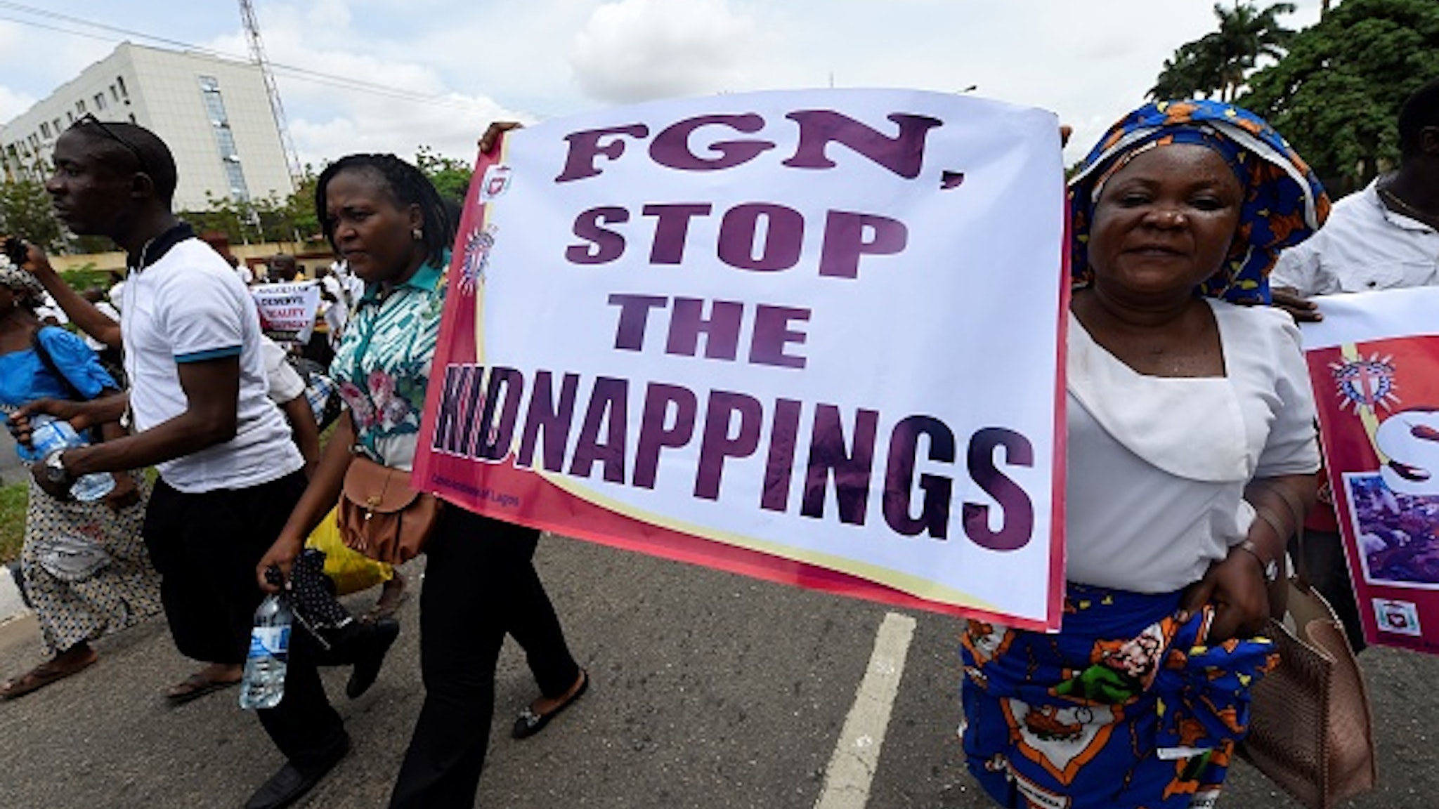 Women take part in a march to protest against victims of violent attacks across the country in Lagos, on May 22, 2018. - Catholic Churches in Nigeria held solidarity rally across the country to prortest against a church attack in Benue state that killed at least 18, including two Roman Catholic priests.