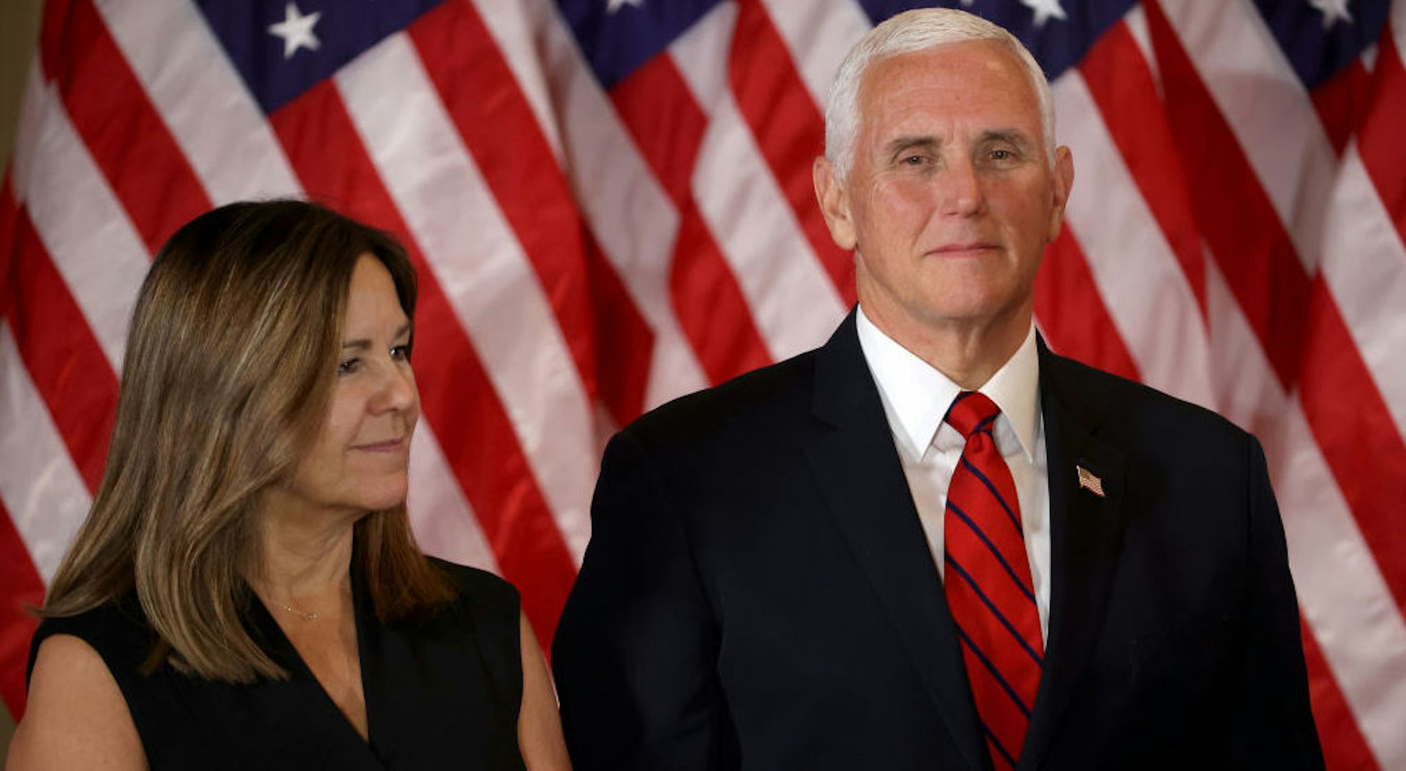 WASHINGTON, DC - NOVEMBER 04: Vice President Mike Pence and Karen Pence look on as U.S. President Donald Trump speaks on election night in the East Room of the White House in the early morning hours of November 04, 2020 in Washington, DC. Trump spoke shortly after 2am with the presidential race against Democratic presidential nominee Joe Biden still too close to call.
