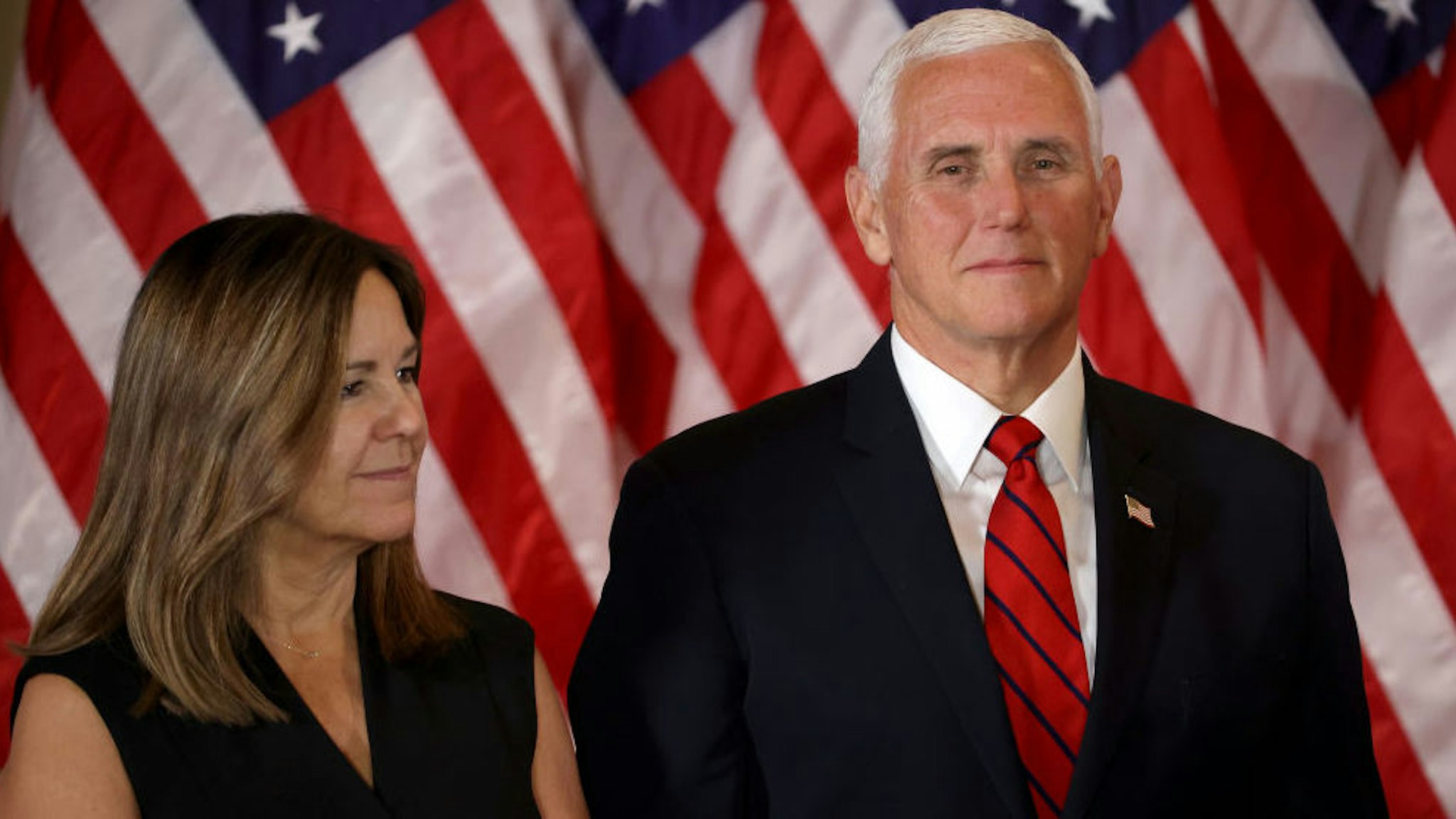 WASHINGTON, DC - NOVEMBER 04: Vice President Mike Pence and Karen Pence look on as U.S. President Donald Trump speaks on election night in the East Room of the White House in the early morning hours of November 04, 2020 in Washington, DC. Trump spoke shortly after 2am with the presidential race against Democratic presidential nominee Joe Biden still too close to call.