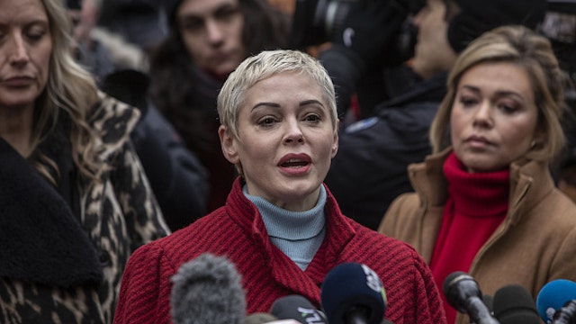 Actress Rose McGowan speaks with members of the media after former Weinstein Co. Co-Chairman Harvey Weinstein arrives at state supreme court in New York, U.S., Monday, Jan. 6, 2020. Weinstein's criminal trial, on five felony counts, including predatory sexual assault and rape, is scheduled to begin on Monday in state court in Manhattan. Jury selection could last two weeks, the trial six more.