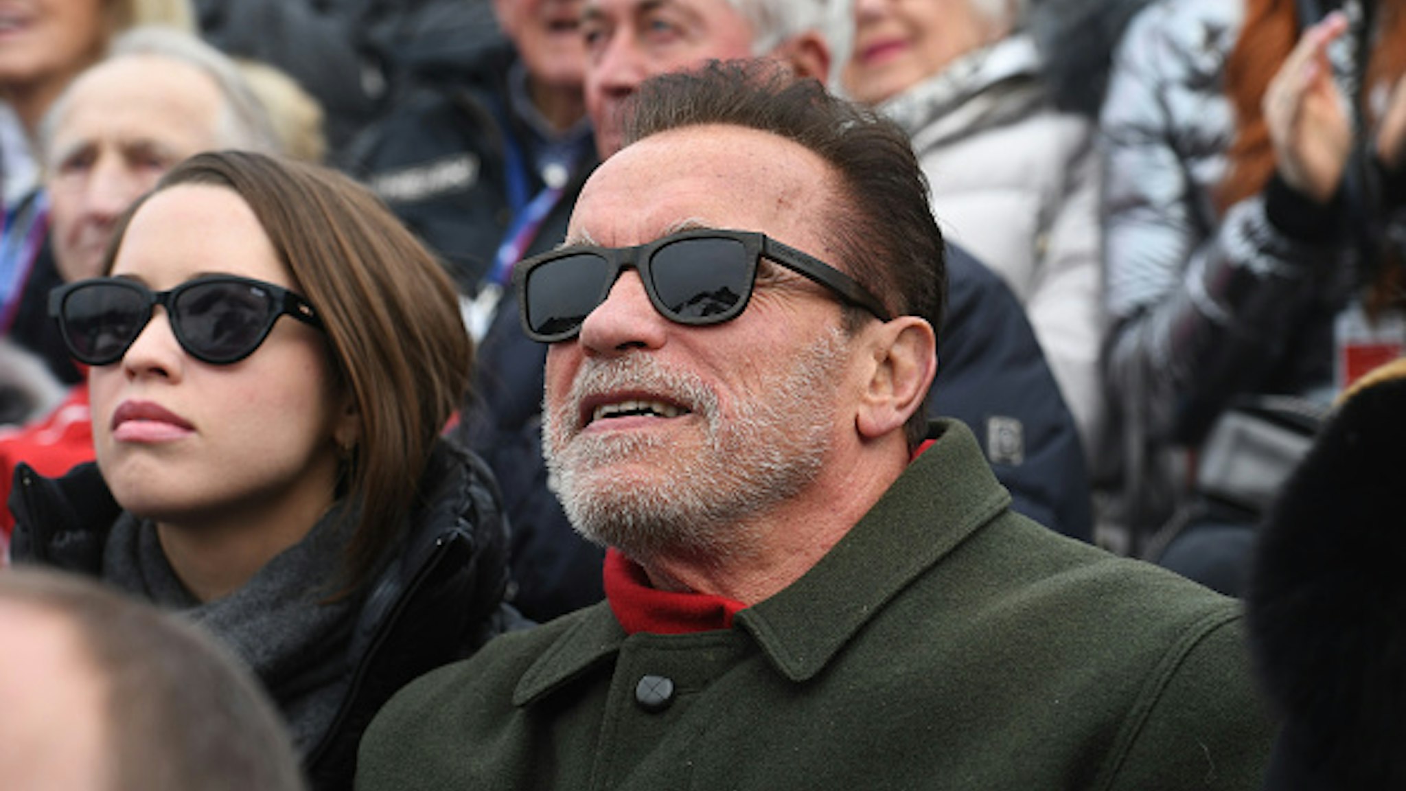 25 January 2020, Austria, Kitzbühel: The actor Arnold Schwarzenegger watches the men's downhill race on the Streif from the VIP tribune in the finish area of the Hahnenkamm race. Photo: Felix Hörhager/dpa - ATTENTION: Only for editorial use in connection with current reporting and only with full mention of the above credit. No advertising.