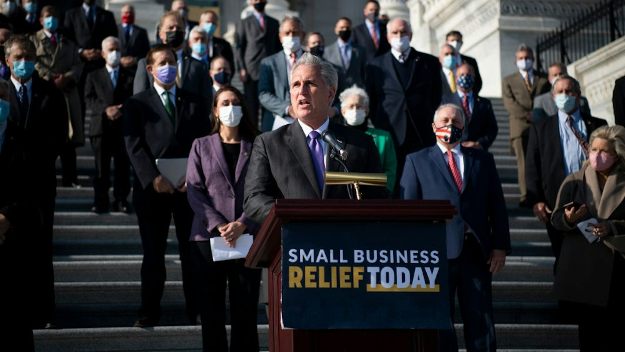 UNITED STATES - December 10: House Minority Leader Kevin McCarthy, R-Calif., joined by other House Republicans, speaks during a news conference on the House steps in Washington on Thursday, Dec. 10, 2020. McCarthy and House Republicans discussed their desire to extend the Paycheck Protection Program and provide relief for small business owners and their employees who have been affected by the coronavirus pandemic.