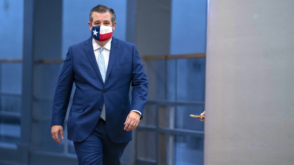 Senator Ted Cruz, a Republican from Texas, wears a protective mask as he walks in the Senate Subway of the U.S. Capitol ahead of a confirmation vote in Washington, D.C., U.S., on Monday, Oct. 26, 2020. The Senate voted 52-48 Monday to confirm Amy Coney Barrett to the U.S. Supreme Court, giving the court a 6-3 conservative majority that could determine the future of the Affordable Care Act and abortion rights.