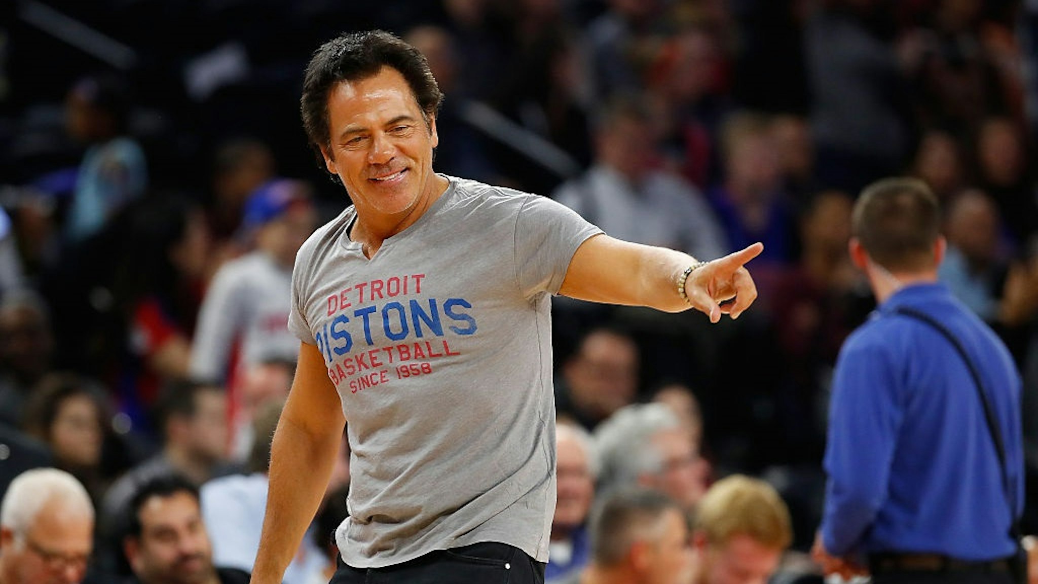 AUBURN HILLS, MI - OCTOBER 28: Detroit Pistons owner Tom Gores throws tee shits into the stands during the Detroit Pistons home opener against the Orlando Magic at the Palace of Auburn Hills on October 28, 2016 in Auburn Hills, Michigan.