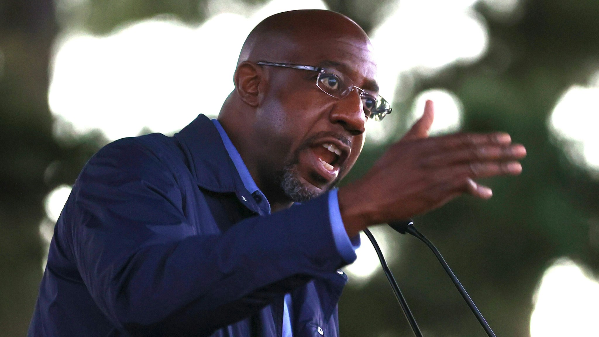 COLUMBUS, GEORGIA - OCTOBER 29: Democratic U.S. Senate candidate Rev. Raphael Warnock speaks during a "Get Out the Early Vote" drive-in campaign event on October 29, 2020 in Columbus, Georgia. With less than a week to go until Election Day, Democratic candidates for the U.S. Senate in Georgia are continuing to campaign throughout the state.