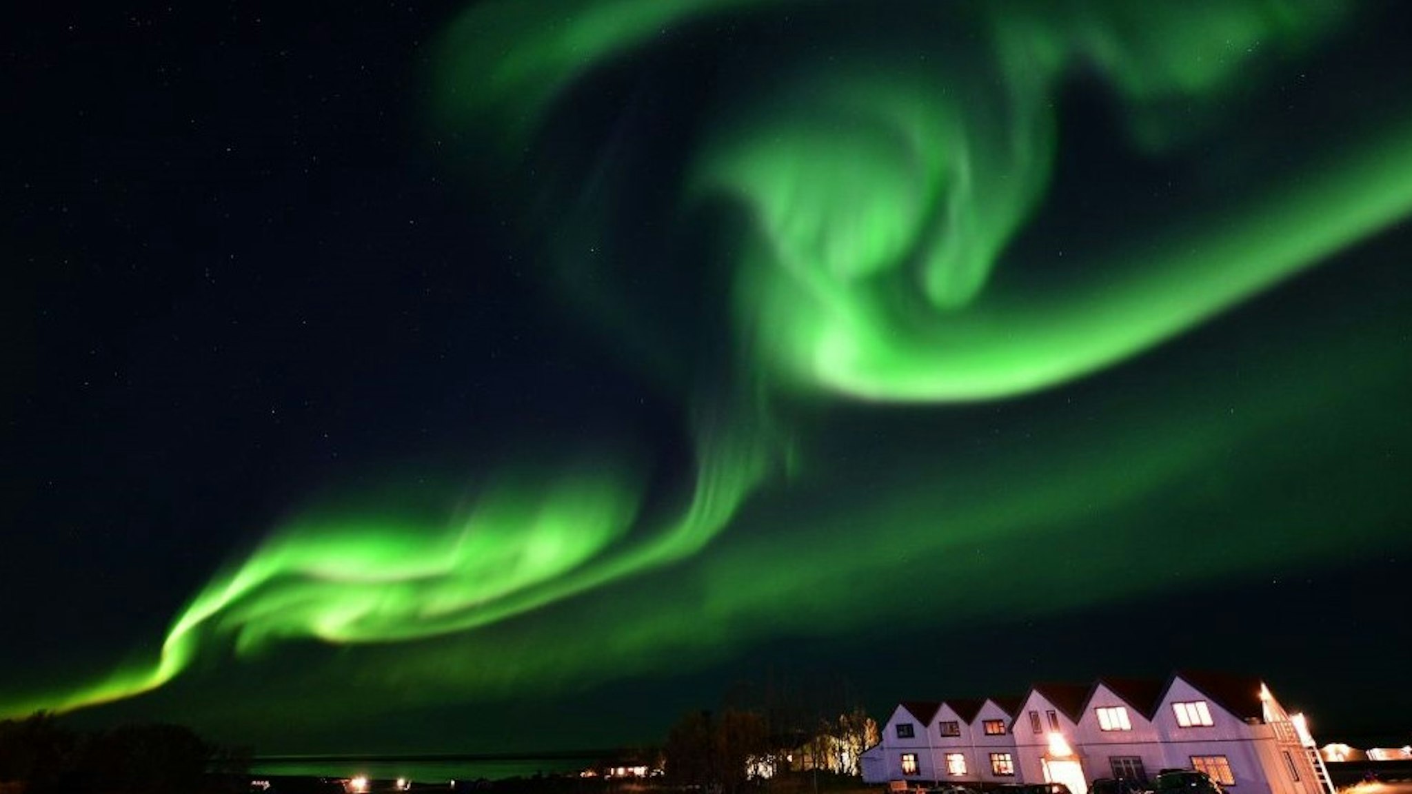 TOPSHOT - The aurora borealis, also known as northern lights, illuminates the sky along the Ring Road in southeastern Iceland, between Jokulsarlon glacier lagoon and Hofn, on October 7, 2018. (Photo by Mariana SUAREZ / AFP) (Photo by