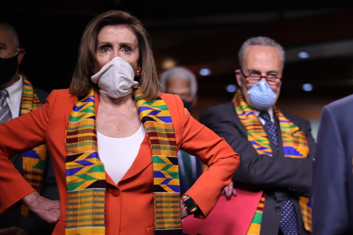 Nancy Pelosi with her hands on her hips