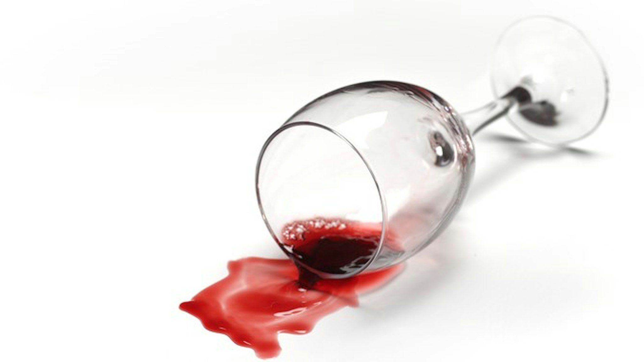 GLASS OF RED WINE KNOCKED OVER