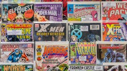 Comics Rack of comic books for sale at a flea market.
