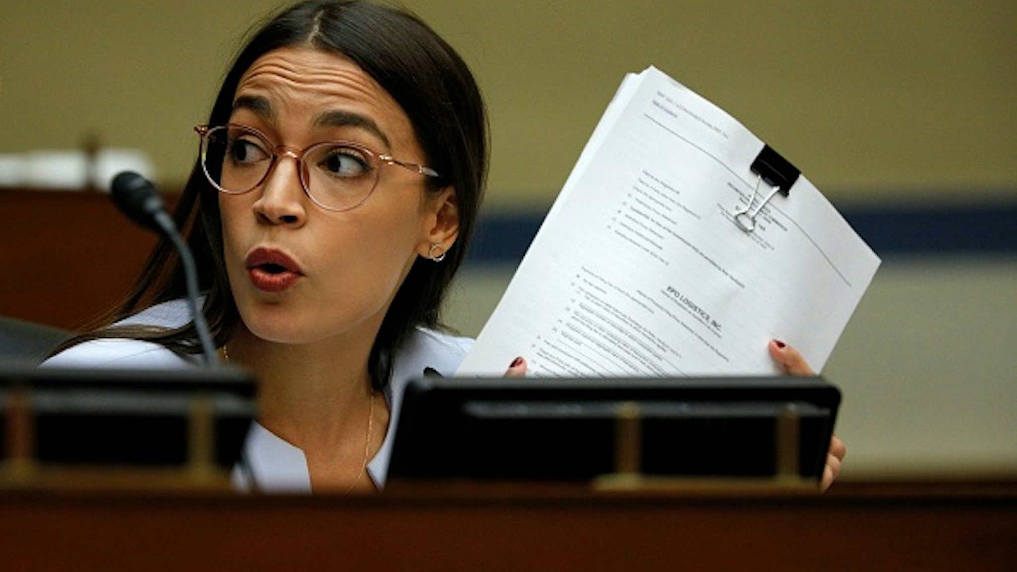 WASHINGTON, DC - AUGUST 24: Rep. Alexandria Ocasio-Cortez (D-NY) asks a question as U.S. Postmaster General Louis DeJoy testifies at a House Oversight and Reform Committee hearing in the Rayburn House Office Building on August 24, 2020 on Capitol Hill in Washington, DC. The committee is holding a hearing on "Protecting the Timely Delivery of Mail, Medicine, and Mail-in Ballots."