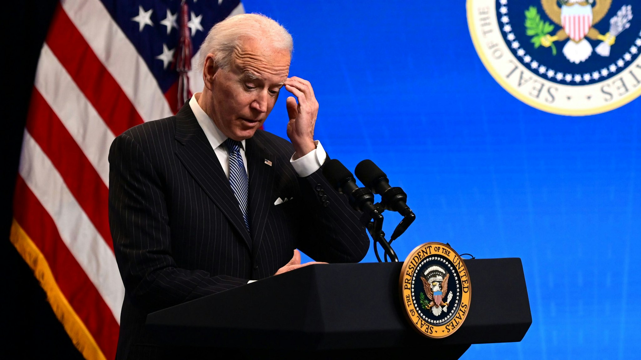US President Joe Biden answers questions from the media after signing a "Made in America" Executive Order in the South Court Auditorium at the White House on January 25, 2021 in Washington, DC.