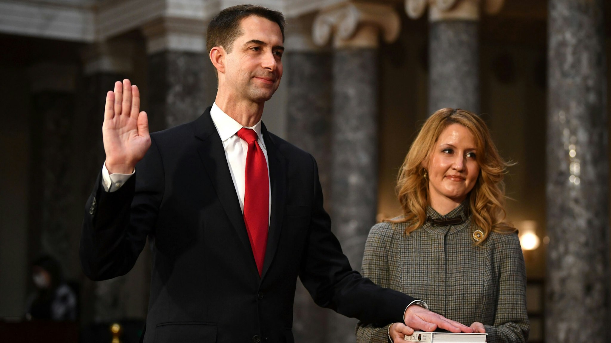 WASHINGTON, DC - JANUARY 3: Sen. Tom Cotton, R-Ark., participates in a mock swearing-in for the 117th Congress with Vice President Mike Pence, as his wife Anna Peckham holds a bible, in the Old Senate Chambers at the U.S. Capitol Building January 3, 2021 in Washington, DC. Both chambers are holding rare Sunday sessions to open the new Congress on January 3 as the Constitution requires.