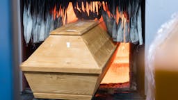 Cremation A coffin is moved for cremation into the furnace at the crematorium in Meissen, eastern Germany on January 13, 2021, during the ongoing novel coronavirus (Covid-19) pandemic.