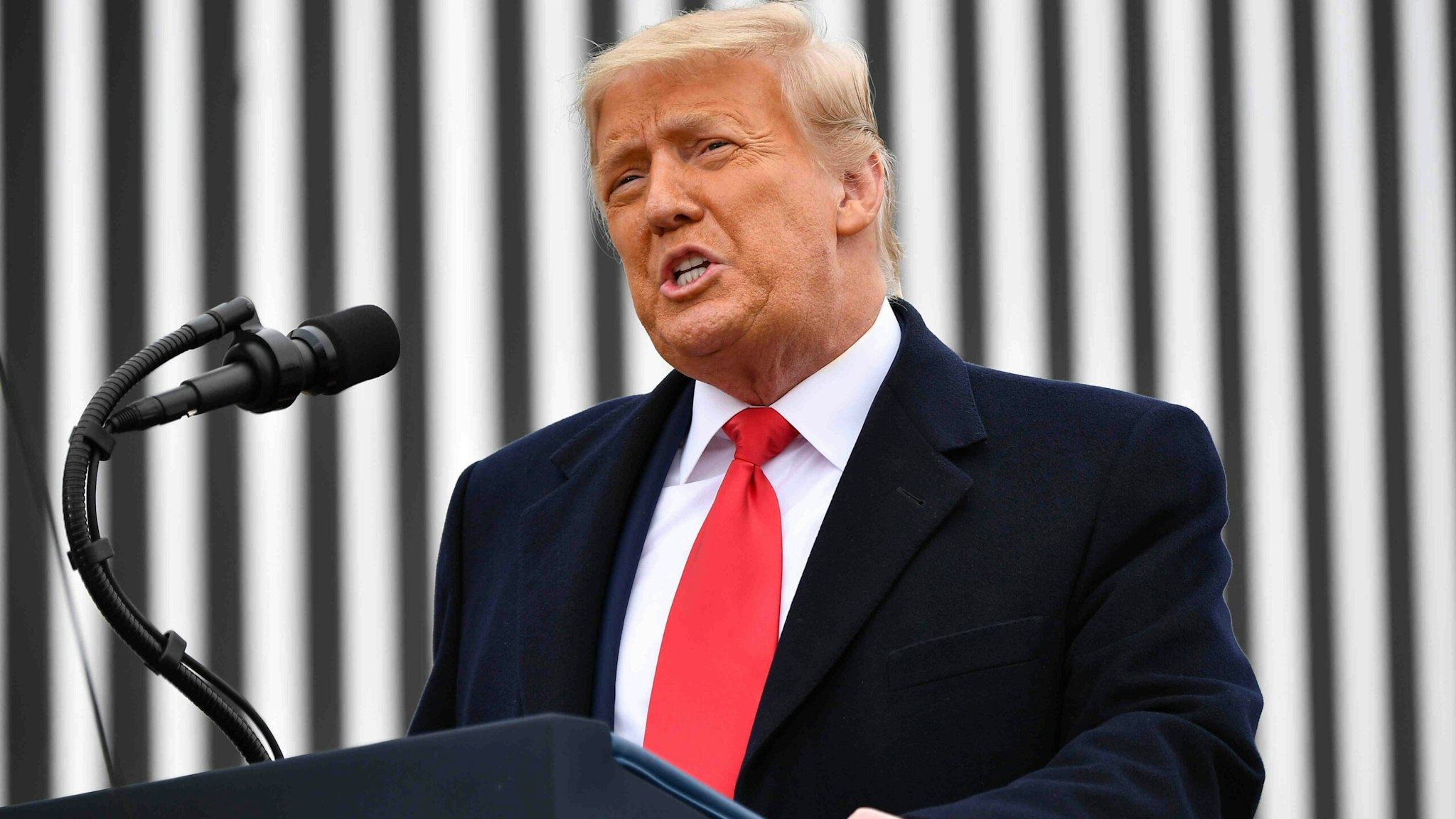 US President Donald Trump speaks after touring a section of the border wall in Alamo, Texas on January 12, 2021.