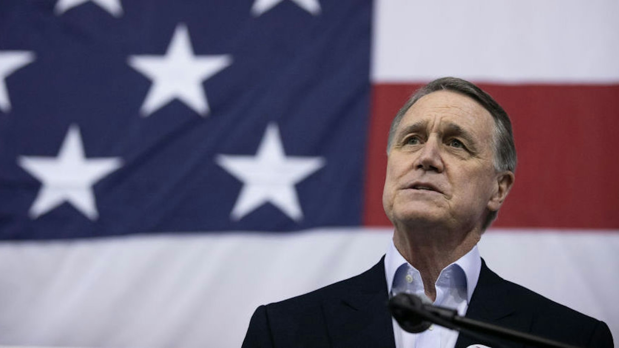 ATLANTA, GA - DECEMBER 14: Sen. David Perdue (R-GA) addresses the crowd during a campaign rally at Peachtree Dekalb Airport on December 14, 2020 in Atlanta, Georgia. As early voting begins, Perdue is facing Democratic candidate Jon Ossoff in a runoff election. The results of two Georgia Senate races will determine the party that controls the majority in the U.S. Senate.