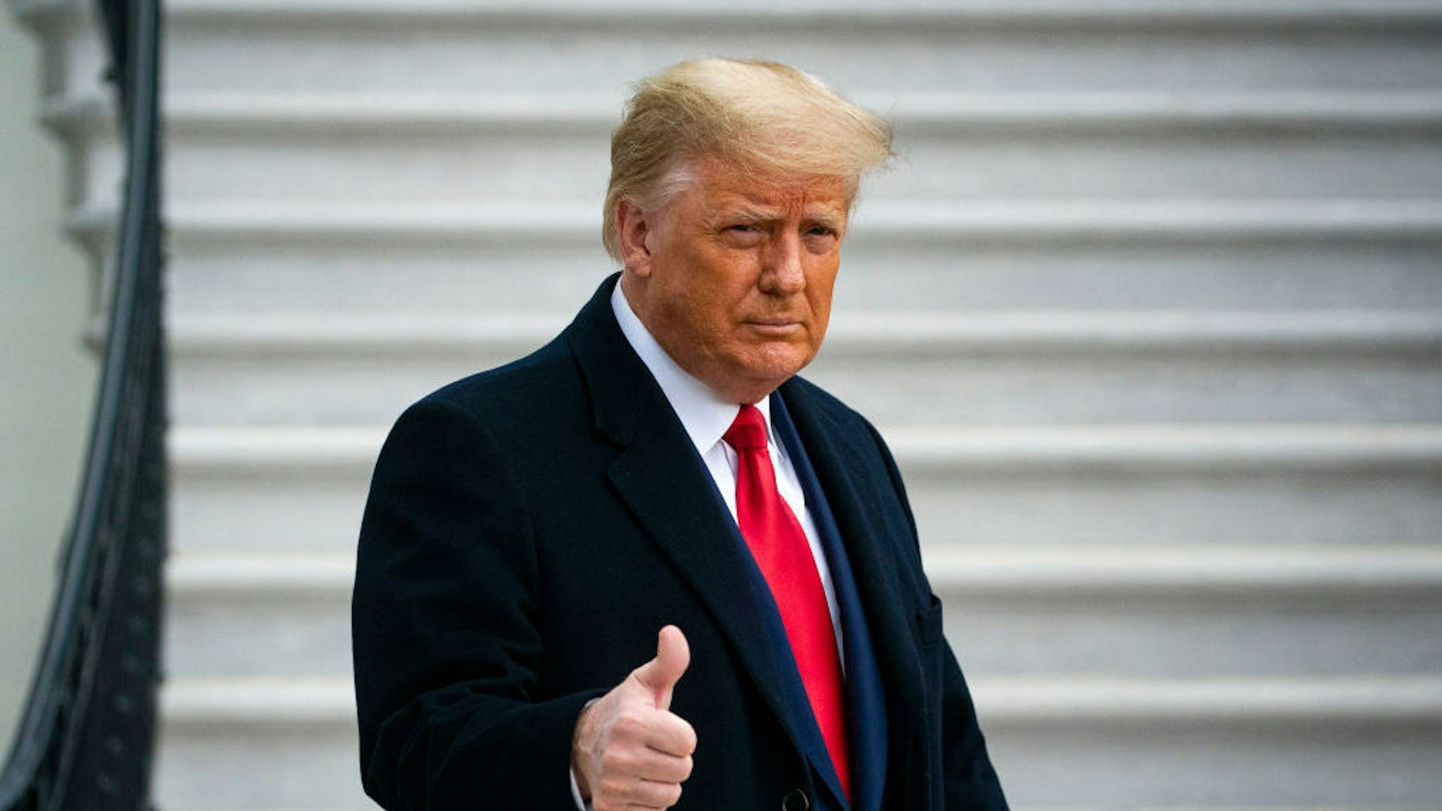 WASHINGTON, DC - DECEMBER 12: U.S. President Donald Trump gives a thumbs up as he departs on the South Lawn of the White House, on December 12, 2020 in Washington, DC. Trump is traveling to the Army versus Navy Football Game at the United States Military Academy in West Point, NY. (Photo by Al Drago/Getty Images)