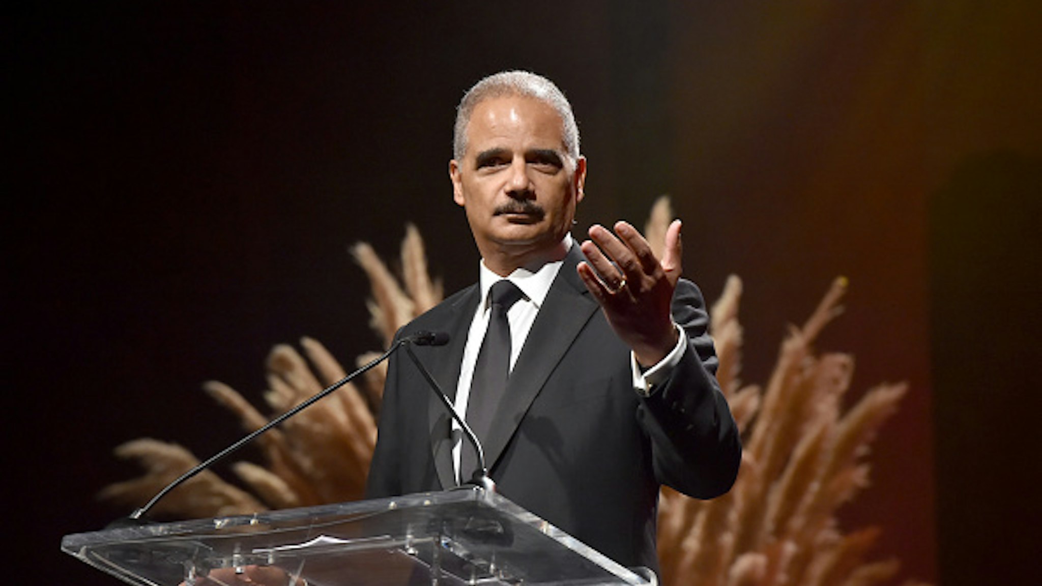 SANTA MONICA, CALIFORNIA - OCTOBER 10: 82nd Attorney General of the U.S. Eric Holder speaks onstage during City Of Hope Spirit Of Life Gala 2019 on October 10, 2019 in Santa Monica, California.