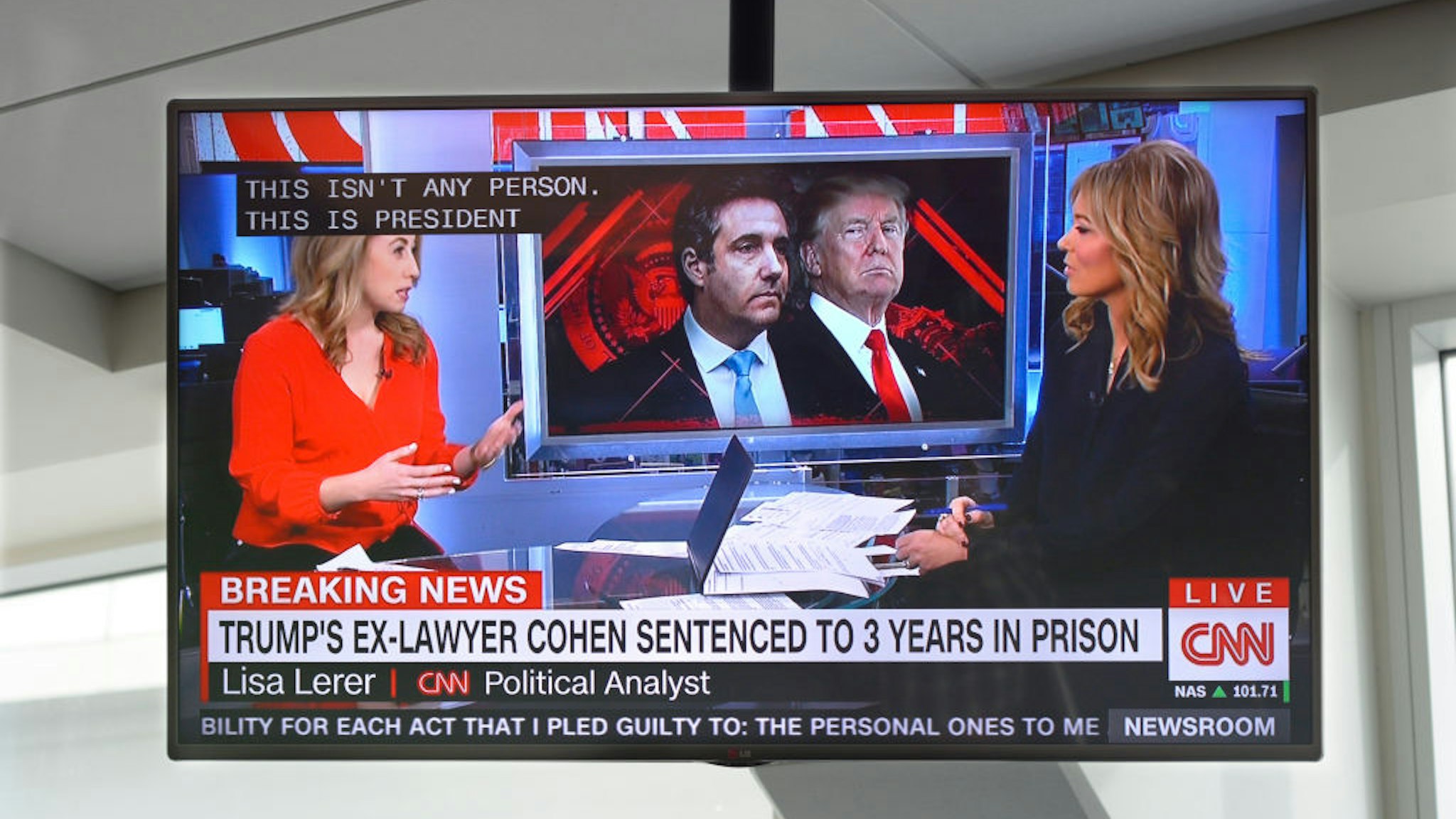 A television monitor at Dallas/Fort Worth International Airport shows a CNN news broadcast with CNN anchor Brooke Baldwin on the day President Trump's former lawyer, Michael Cohen, was sentenced to a prison term.