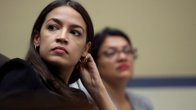 WASHINGTON, DC - JULY 18: Rep. Alexandria Ocasio-Cortez (L) (D-NY) and Rep. Rashida Tlaib (D-MI) listen to testimony from acting Homeland Security Secretary Kevin McAleenan while he testifies before the House Oversight and Reform Committee on July 18, 2019 in Washington, DC. The hearing is on "The Trump Administration's Child Separation Policy." (Photo by Win McNamee/Getty Images)